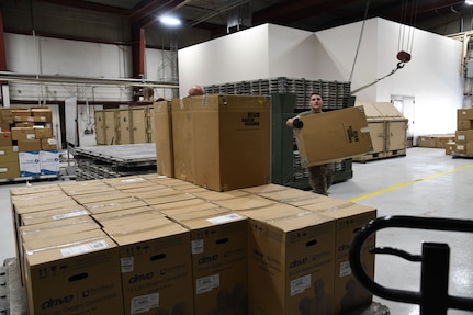 Airmen from the 151st Logistics Readiness Squadron palletize medical equipment and supplies Aug 25, 2021, at Roland Wright Airbase in Salt Lake City, Utah