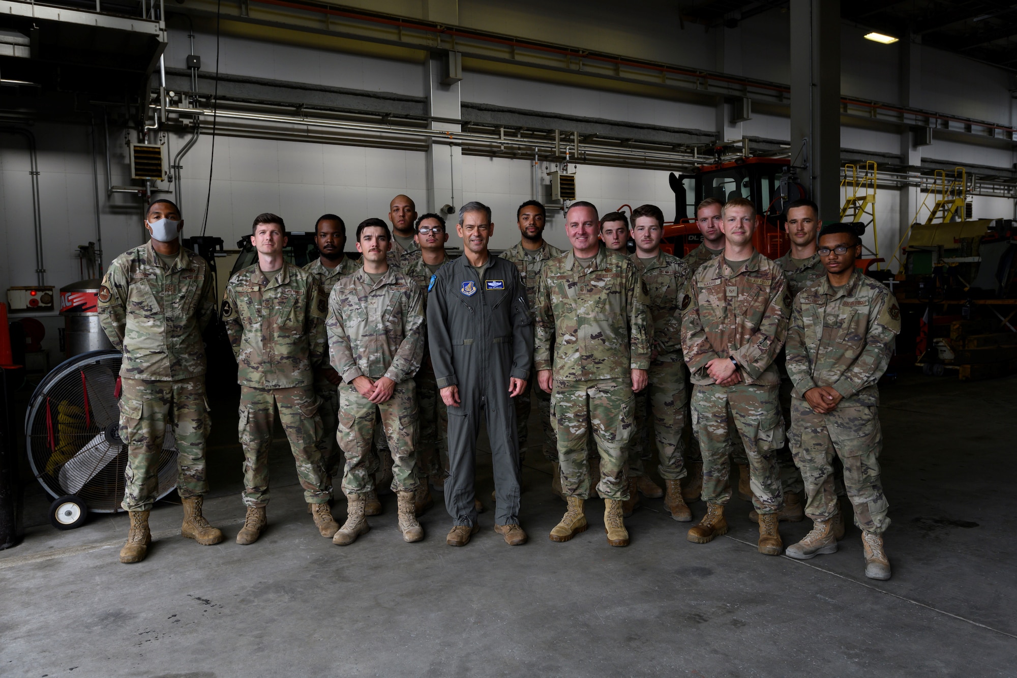 Service members pose for a group photo.