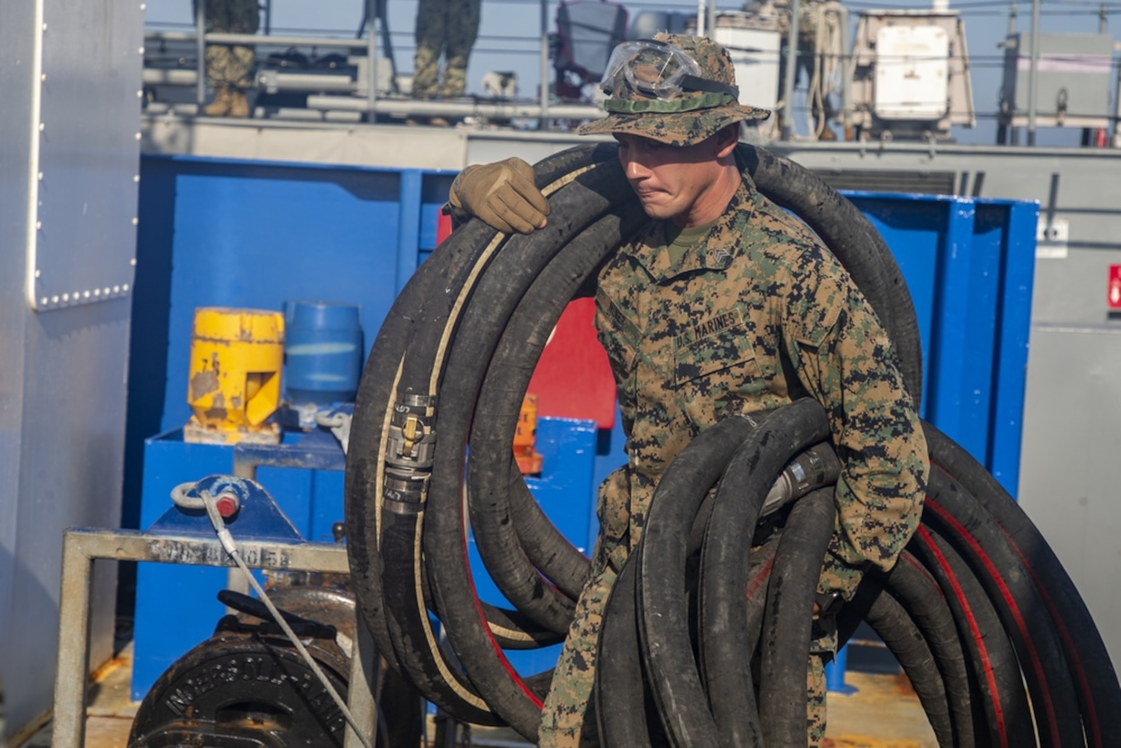 U.S. Marine Sgt. Nicholas D. Niner caries tubes during Large Scale Exercise 2021 at Camp Lejeune, North Carolina, Aug. 8, 2021. LSE 2021 demonstrates the Navy’s ability to employ precise, lethal, and overwhelming force globally across three naval component commands, five numbered fleets, and 17 time zones. LSE 2021 merges live and synthetic training capabilities to create an intense, robust training environment. It will connect high-fidelity training and real-world operations, to build knowledge and skills needed in today’s complex, multi-domain, and contested environment.