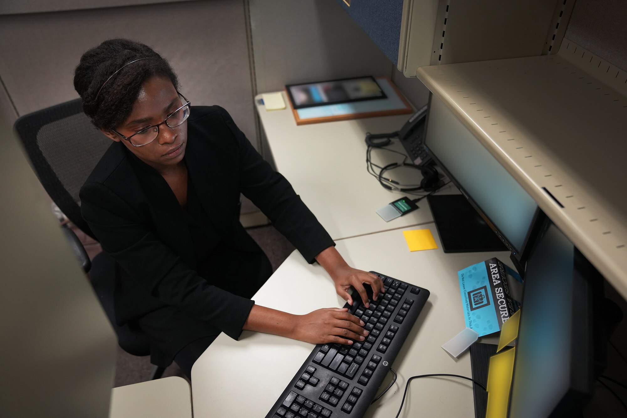 Aura Teasley, U.S. Air Force Premier College Intern, works at U.S. Cyber Command, Fort George G. Meade, Md., Aug. 18, 2021.