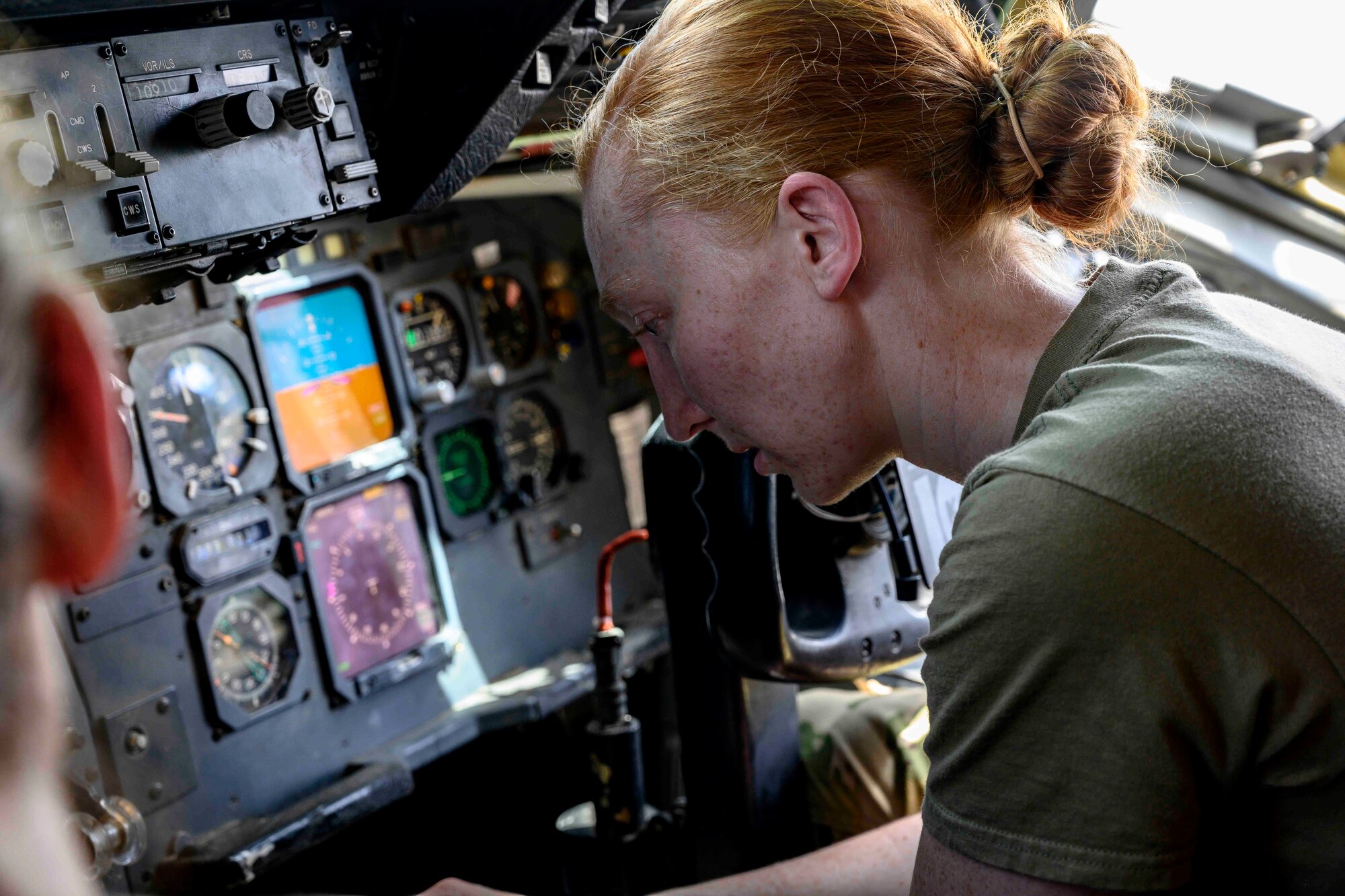 Female pilot in cockpit of aircraft