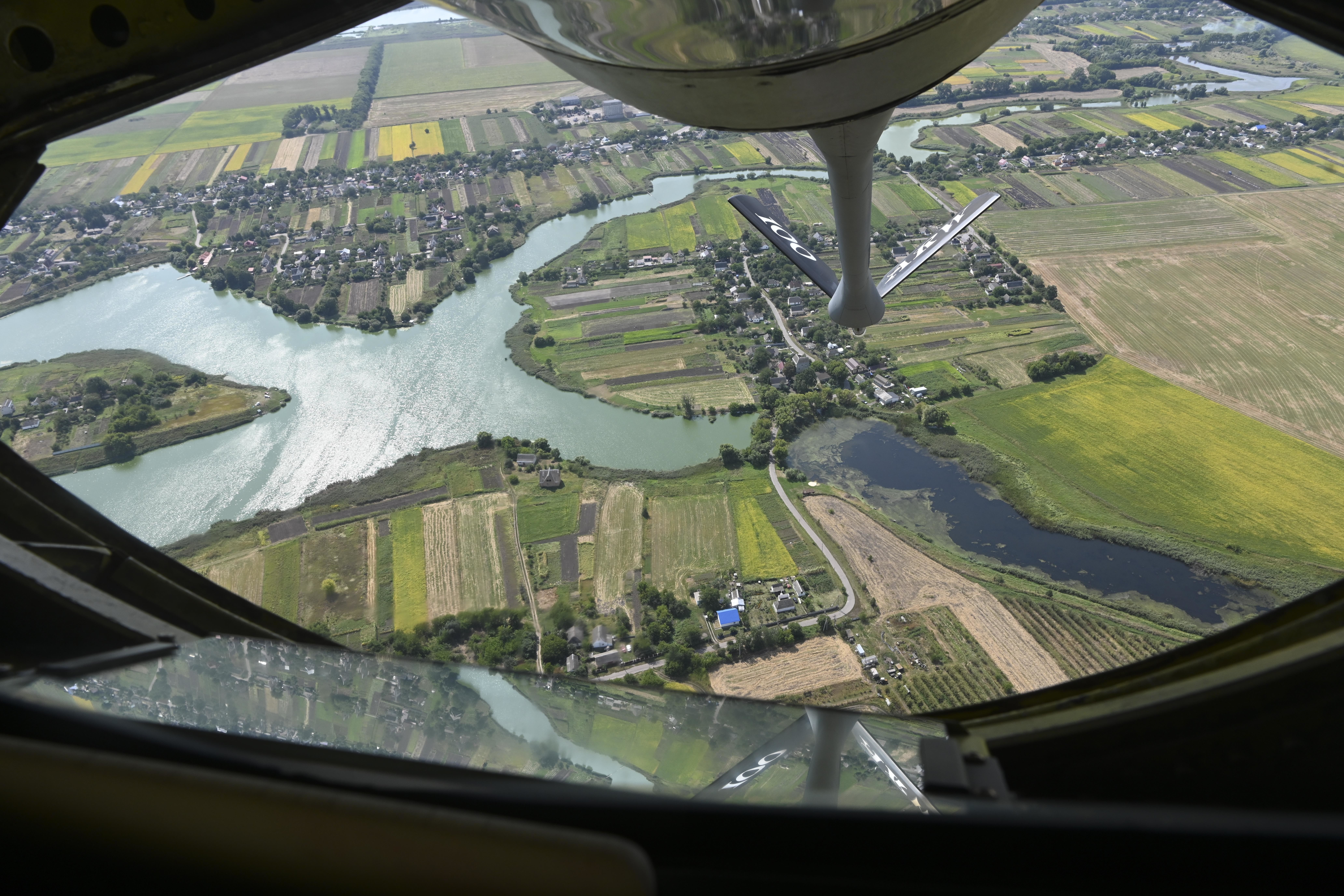 A U.S. Air Force KC-135 Stratotanker aircraft assigned to the 100th Air Refueling Wing, Royal Air Force Mildenhall, England, flies over the Ukrainian countryside before conducting a flyover to commemorate the 30th anniversary of Ukrainian independence Aug, 24, 2021. The U.S. is committed to Ukrainian sovereignty and territorial integrity. (U.S. Air Force photo by Senior Airman Joseph Barron)