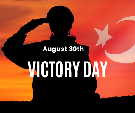 silhouette of Turkish soldier saluting with Turkish flag