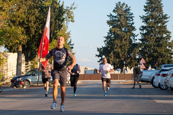 Runner carrying Polish flag