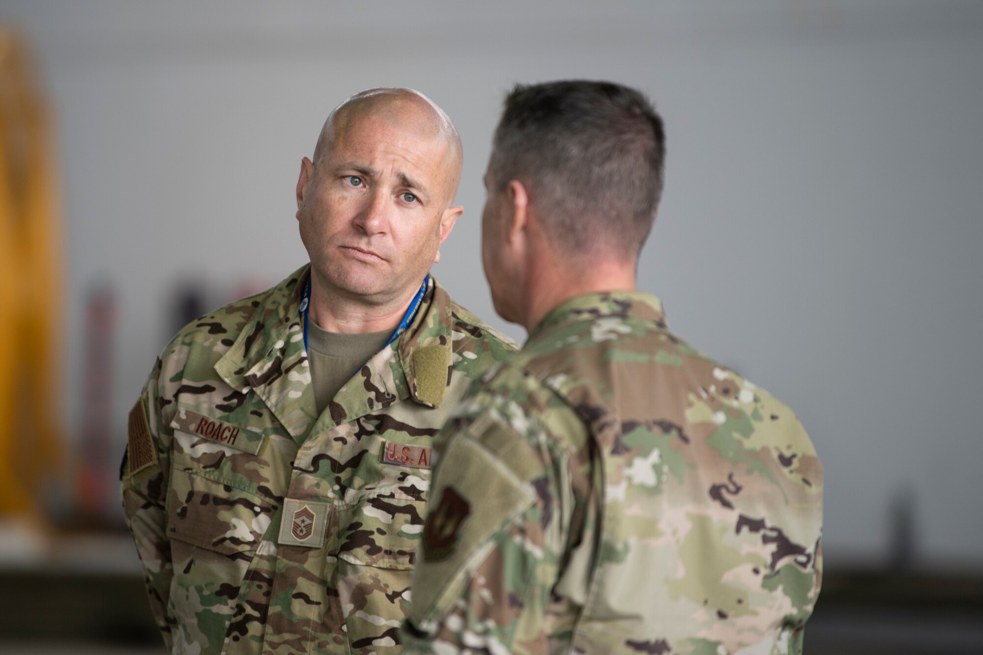 U.S Air Force Chief Master Sgt. Toby Roach, 52nd Fighter Wing command chief, speaks with U.S. Air Force Chief Master Sgt. Brion Blais, U.S. Air Forces in Europe-Air Forces Africa command chief, during the Atlantic Stripe Conference at Spangdahlem Air Base, Germany, Aug. 19, 2021.