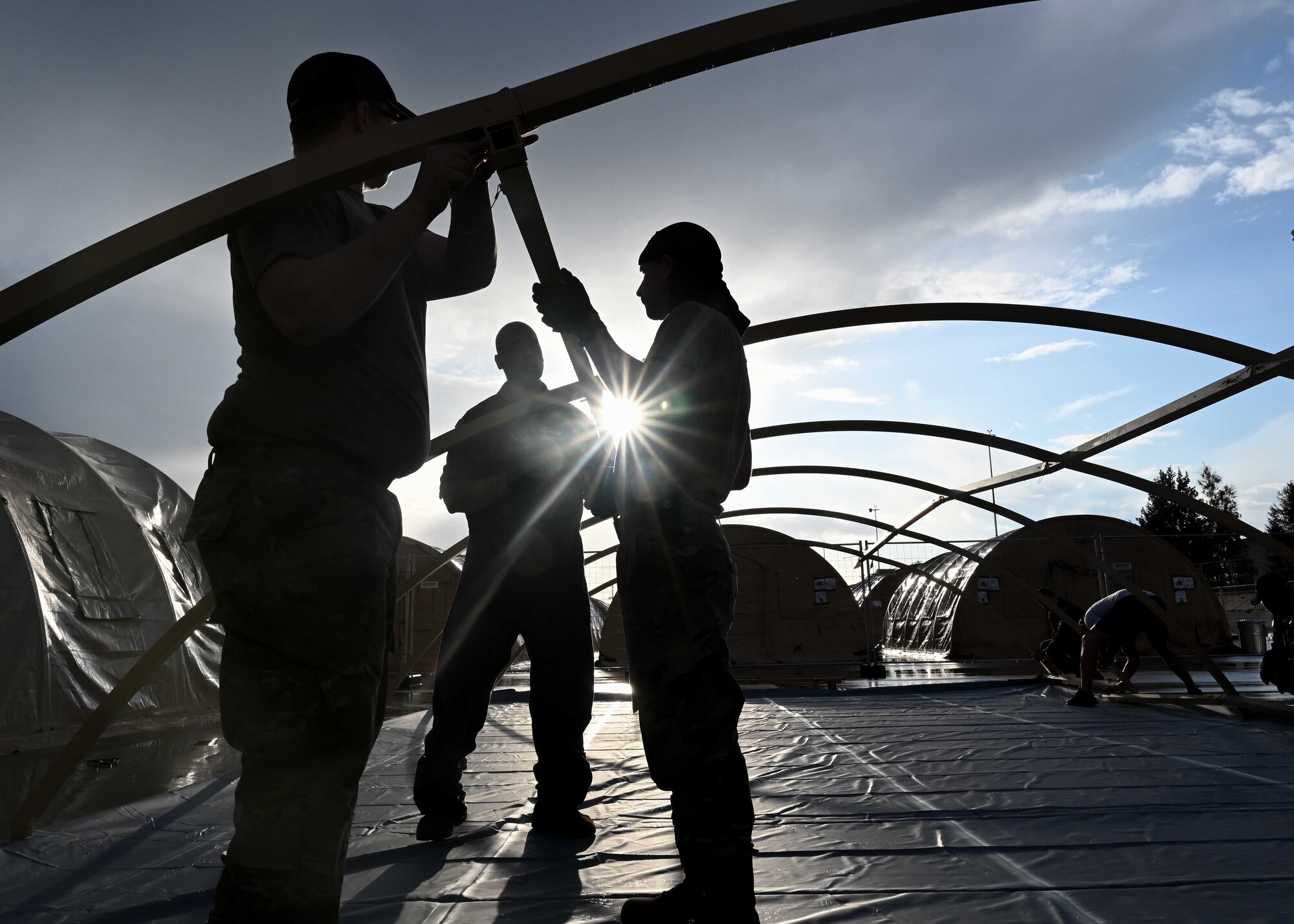 Airmen set up pods.