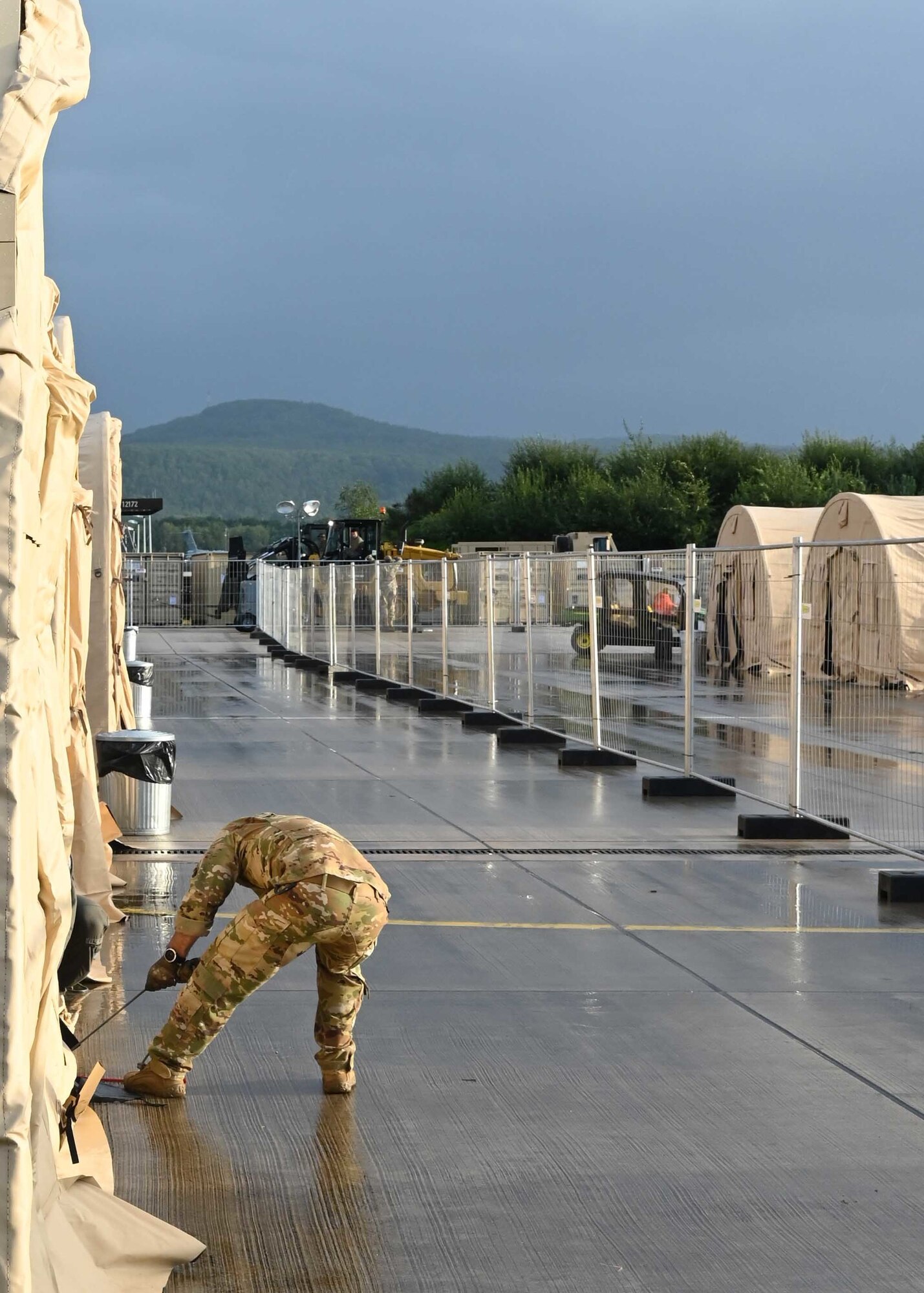 Airman sets up pod.