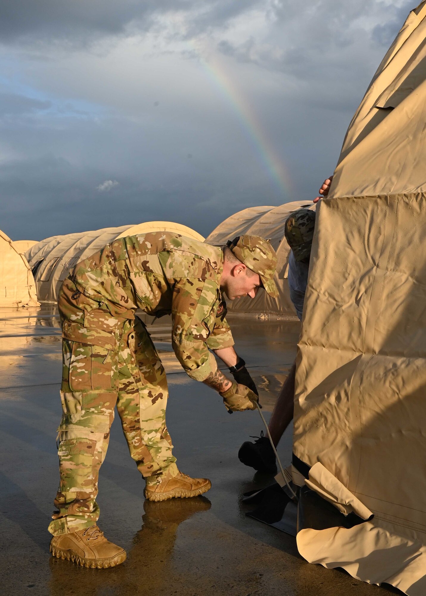 Airman sets up pod.