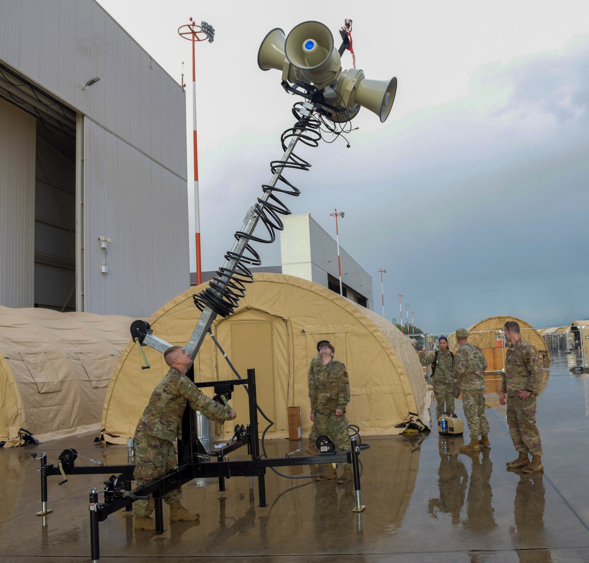 Airmen stand up PA system.