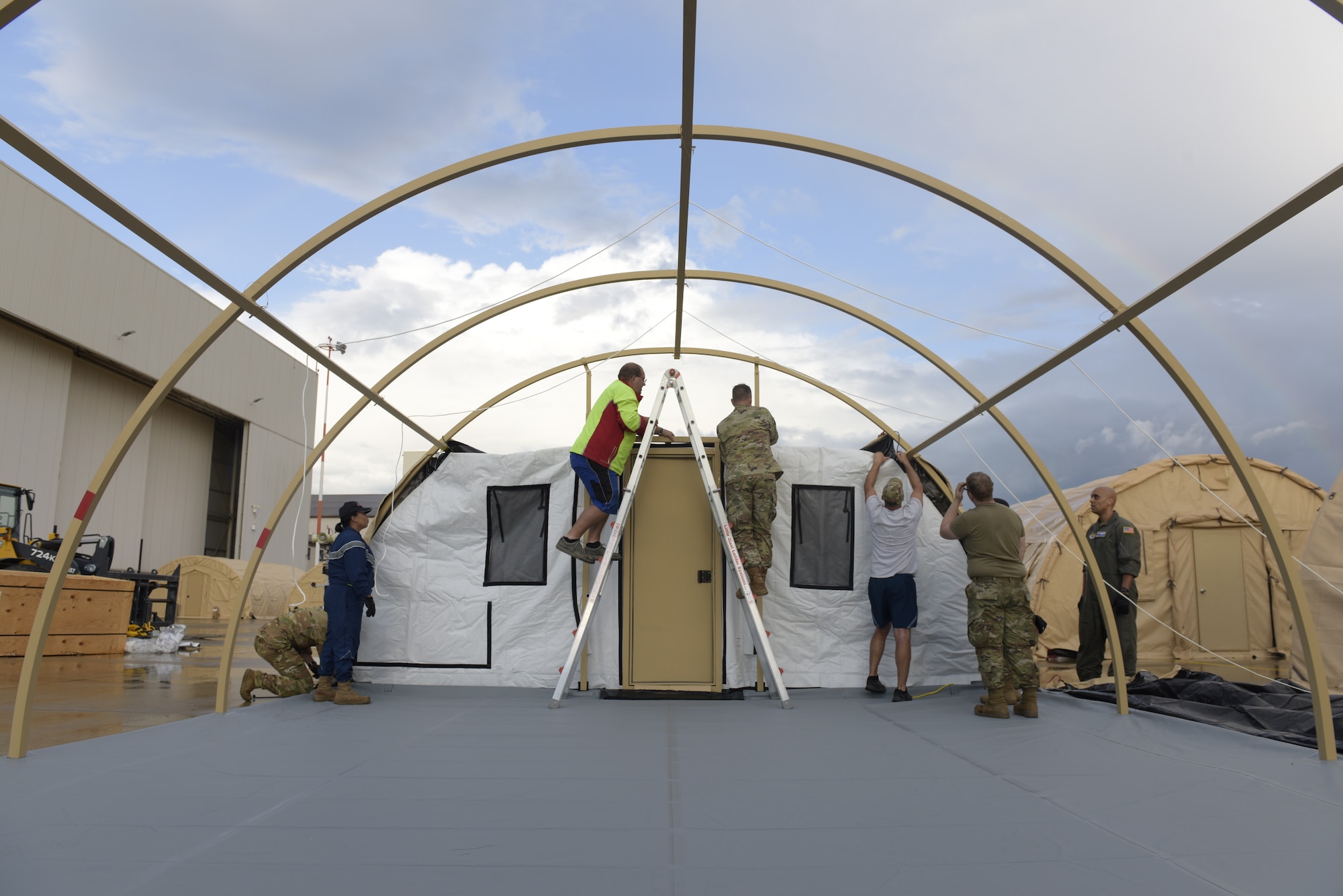 Airmen set up pods.