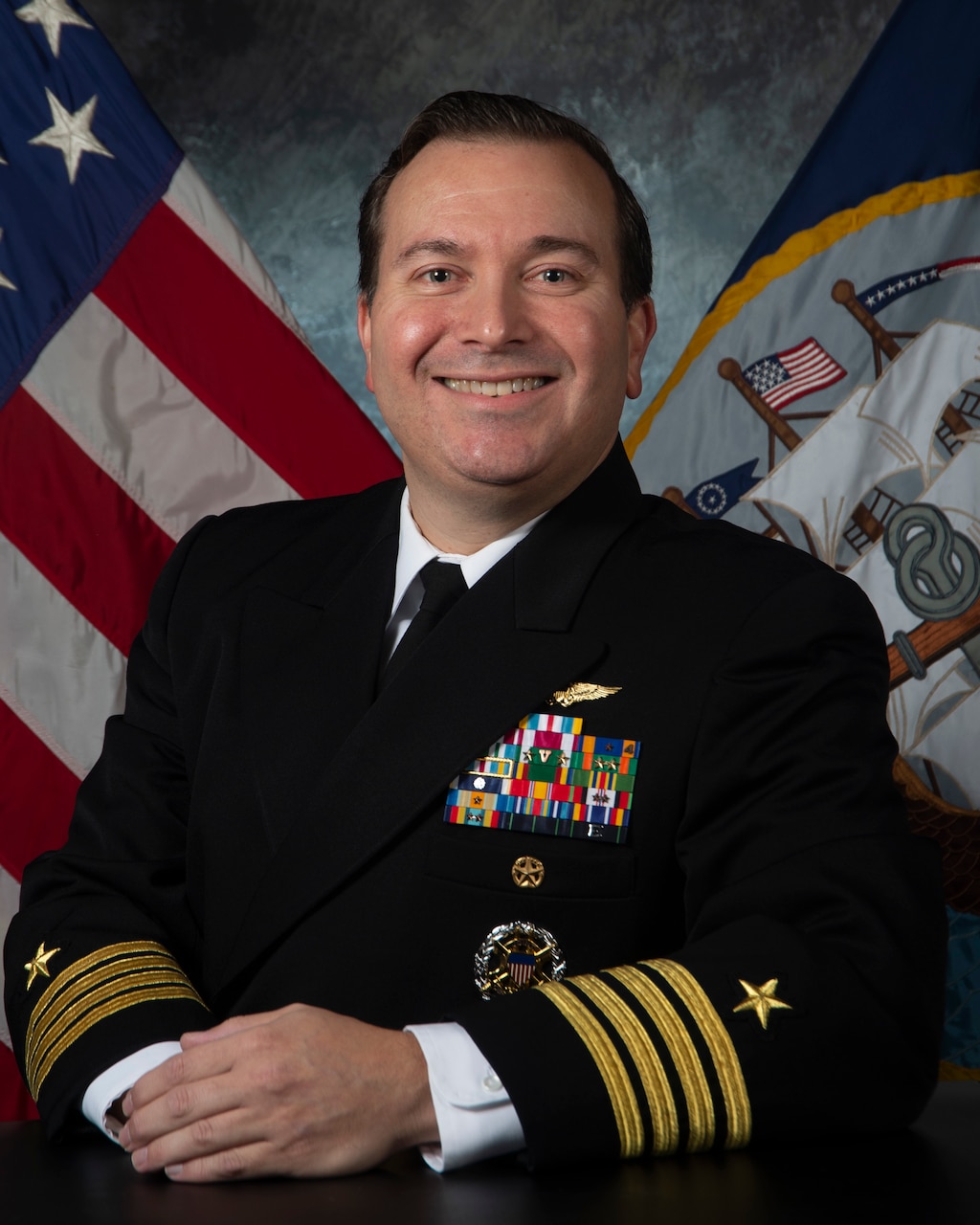 Official studio portrait of Capt. Eric Sinibaldi, Chief of Staff, Carrier Strike Group Eight