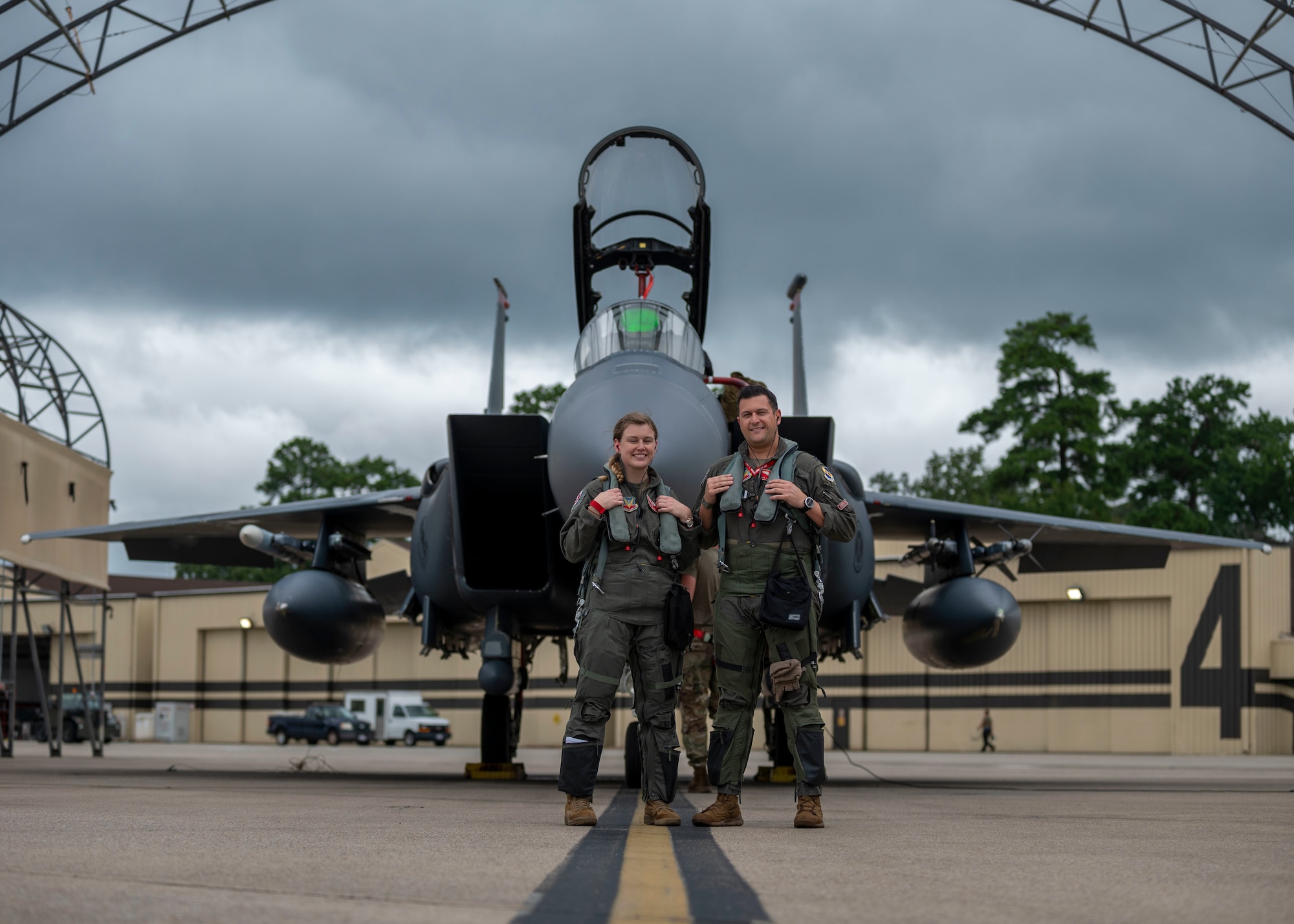 Capt. Lauren Schlichting, left, 333rd Fighter Squadron evaluating pilot and executive officer, and Capt. Andrew Lombardo, 333rd FS weapons system officer, pose for a photo at Seymour Johnson Air Force Base, North Carolina, August 4, 2021.