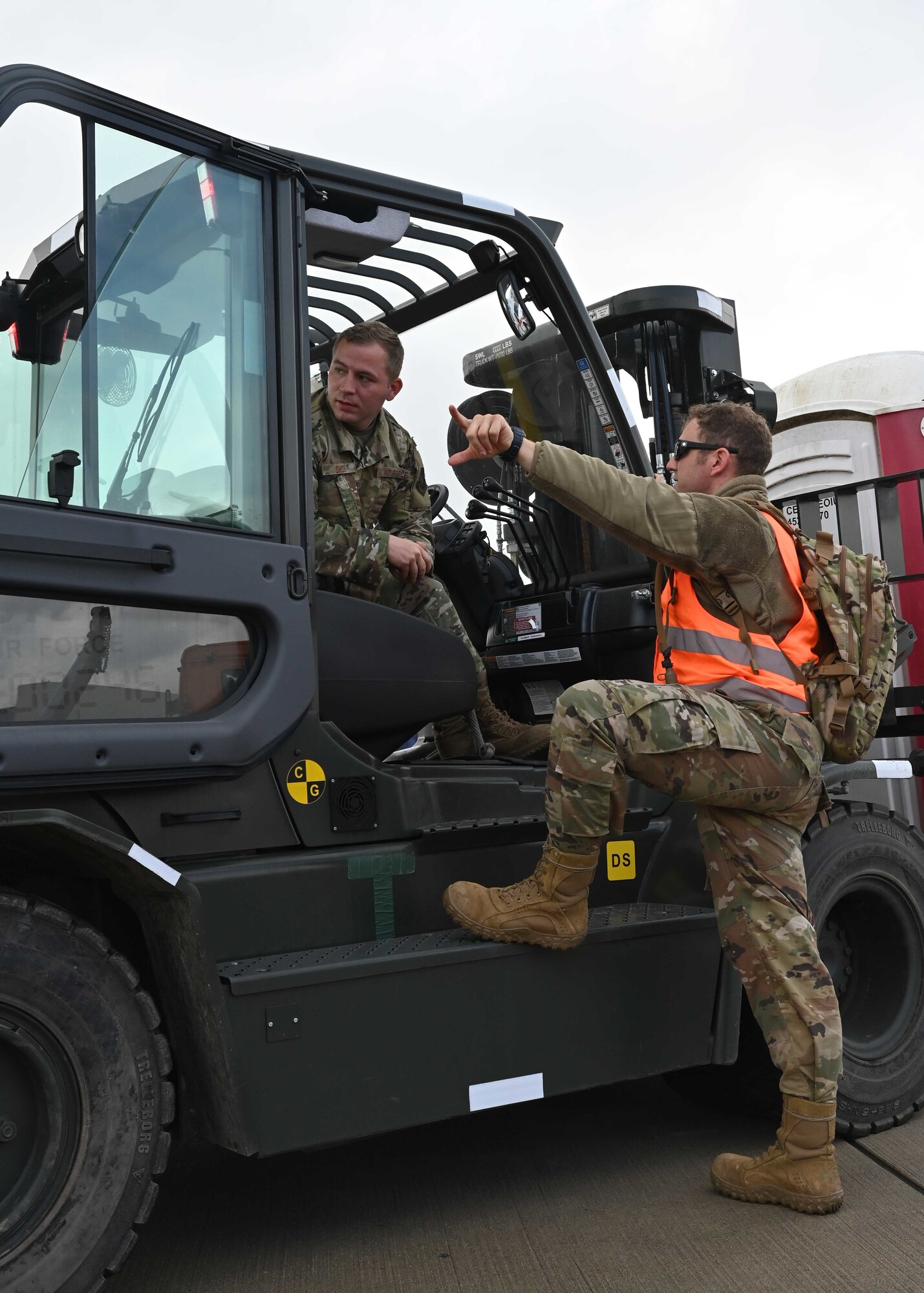 Airmen discuss what need to be done.