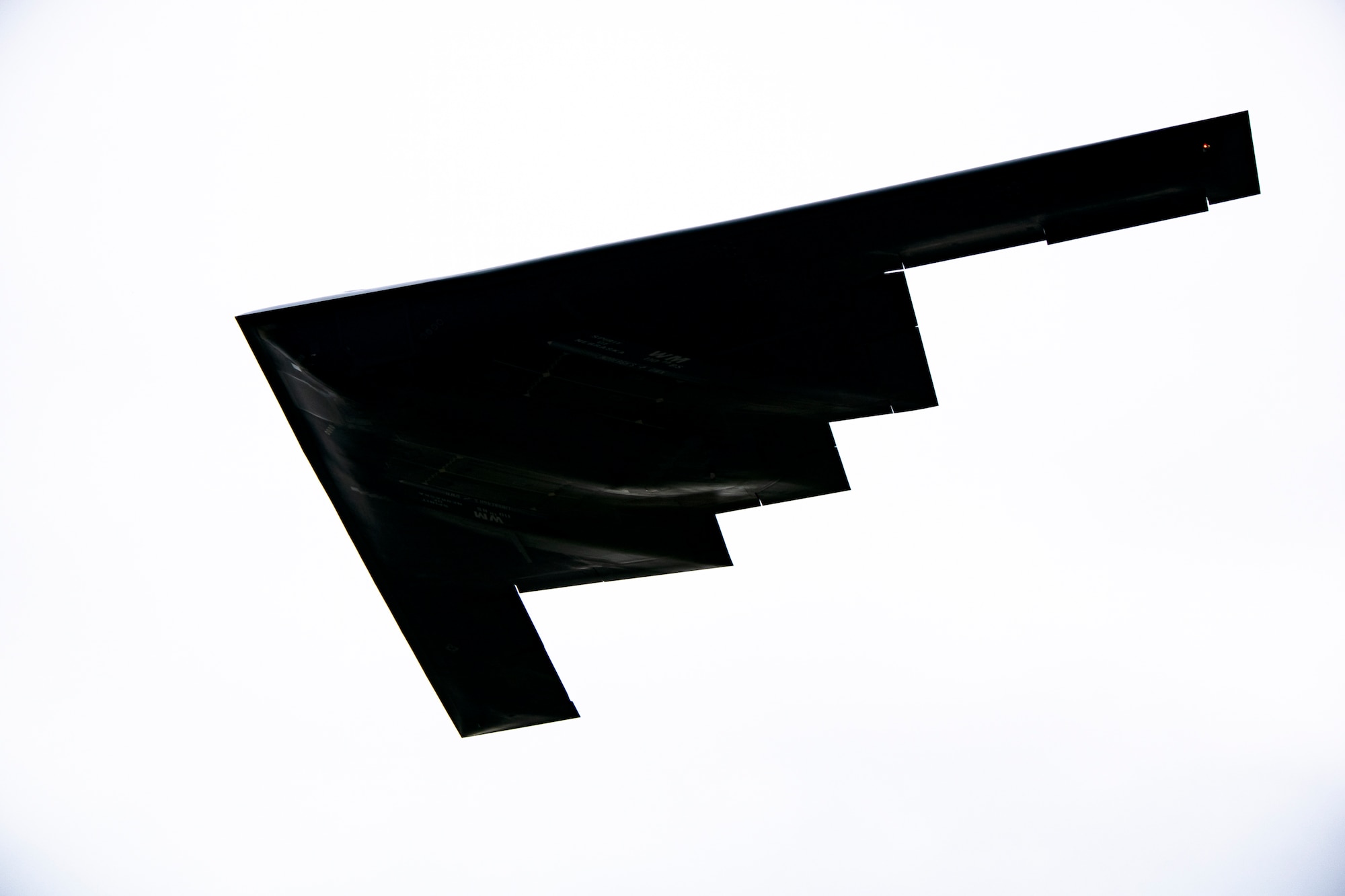 A B-2 Spirit assigned to the 509th Bomb Wing flies overhead at RAF Fairford, England, Aug. 25, 2021. The B-2 flyover was part of a Bomber Task Force mission in which aircraft conduct theater and flight training across Europe and Africa. The BTF missions, which have been occurring since 2018, provide theater familiarization for aircrew members and opportunities for U.S. integration with NATO allies and regional partners. The bomber missions enhance readiness and provide the training necessary to respond to any potential crisis or challenge across the globe. (U.S. Air Force photo by Senior Airman Eugene Oliver)