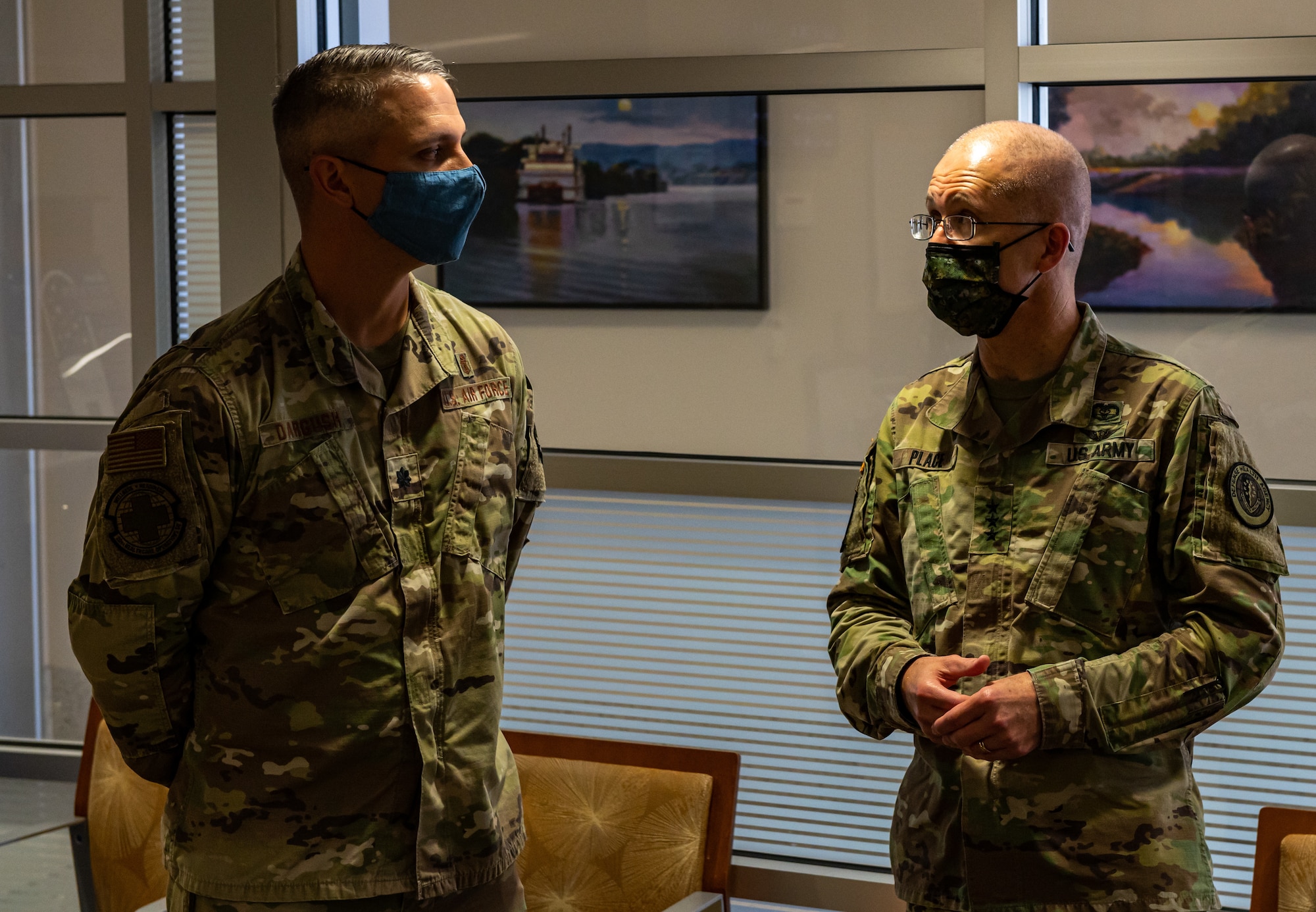 Photo of Soldier and Airman speaking.