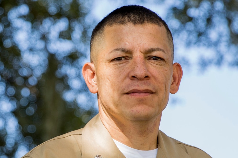 Headshot of a man looking at the camera.