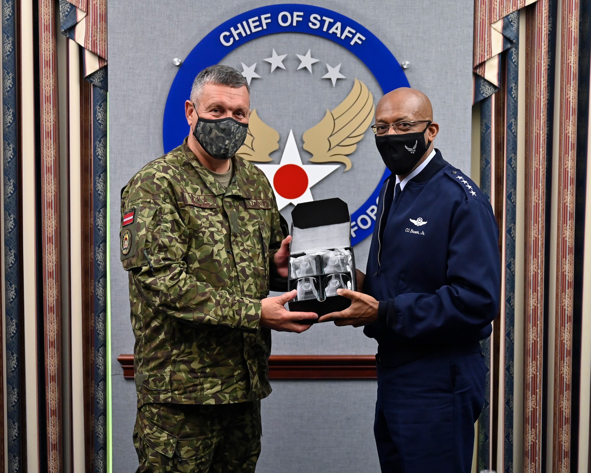Air Force Chief of Staff Gen. CQ Brown, Jr. poses with Lt. Gen. Leonids Kalnins, Latvia chief of defense