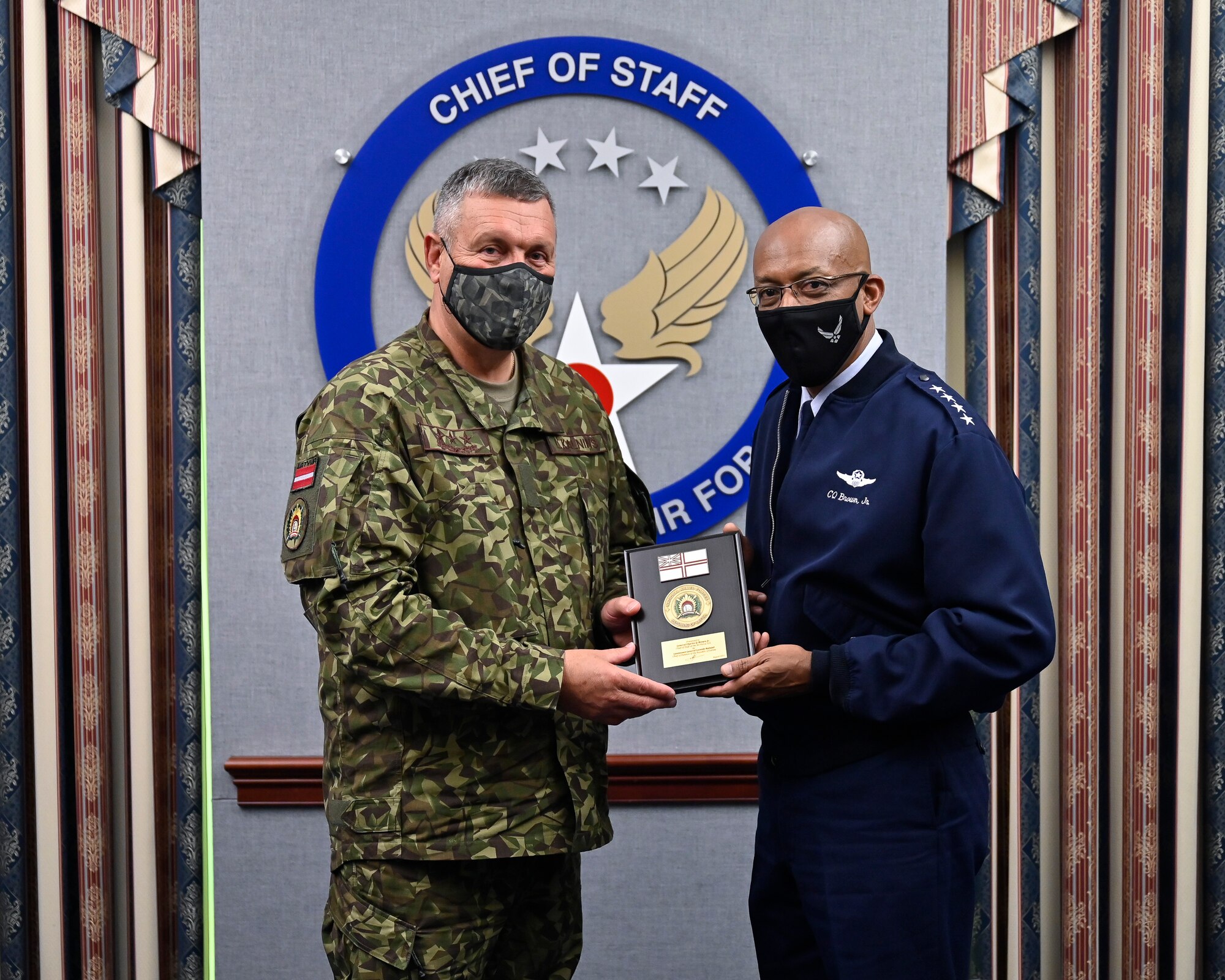 Air Force Chief of Staff Gen. CQ Brown, Jr. poses with Lt. Gen. Leonids Kalnins, Latvia chief of defense