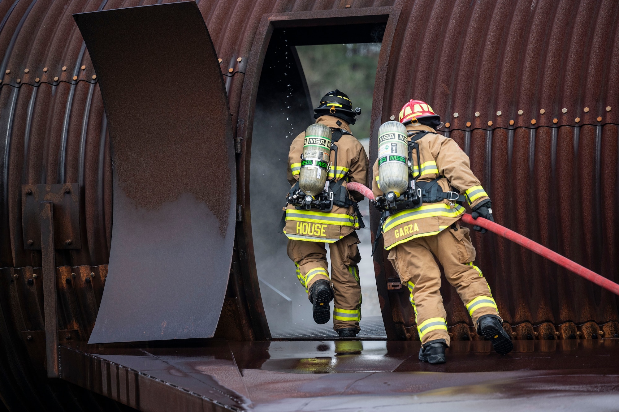Citizen Airman, assigned to the 932nd Airlift Wing, Mission Support Group, participate in firefighter contingency training at Dobbins Air Force Base, Ga., March 18, 2021. The two week training culminated in three days filled with various types of fires and rescue calls. (U.S. Air Force Photo by Mr. Christopher Parr)
