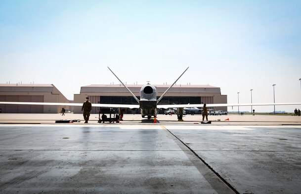 A global hawk sits in the hangar.