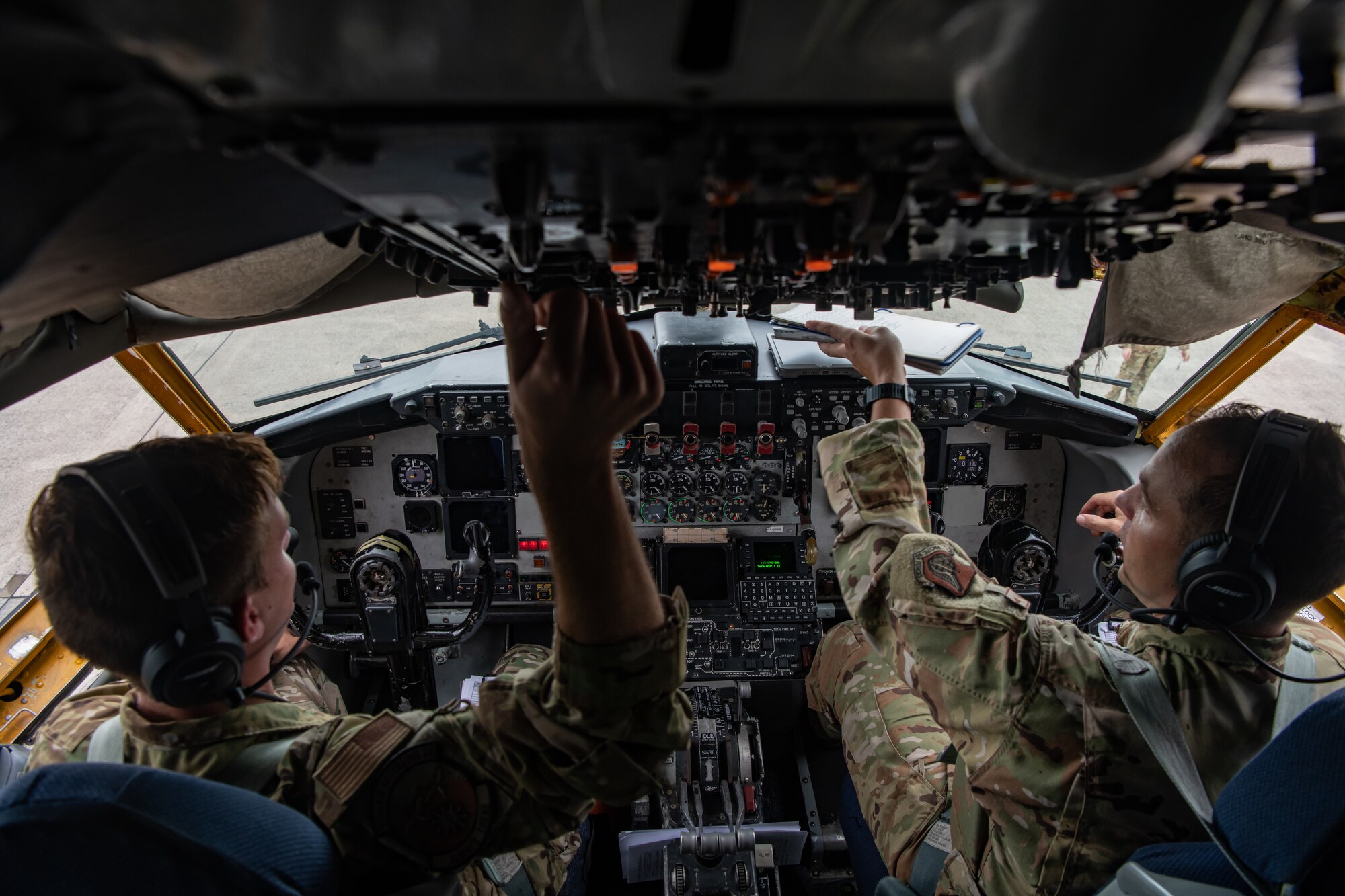 U.S. Air Force Capt. Daniel Thomas (left), 909th Air Refueling Squadron pilot, and Maj. Elliott Sahli, 909th ARS instructor pilot, conduct a preflight check for a KC-135 Stratotanker at Kadena Air Base, Japan in support of Large Scale Global Exercise 21, Aug., 18, 2021. The U.S. joint forces remains ready to respond to the full spectrum of conflict and disaster. (U.S. Air Force photo by Tech. Sgt. Micaiah Anthony)