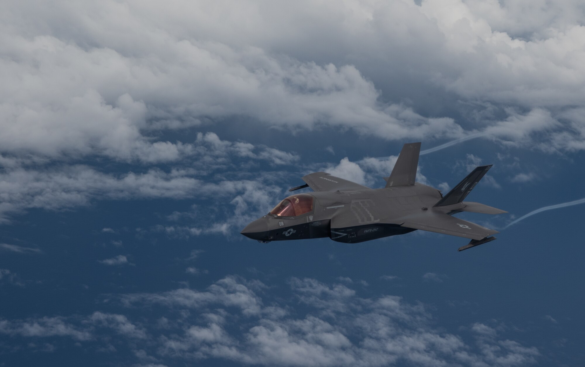 A U.S. Marine Corps F-35B Lightning II, Marine Fighter Attack Squadron based out of Marine Corps Air Station MCAS Iwakuni, Japan breaks away after receiving fuel from a KC-135 Stratotanker assigned to the 909th Air Refueling Squadron, Kadena Air Base, Japan during a Large Scale Global Exercise 21 mission over the western Pacific Ocean, Aug. 18, 2021. LSGE21 contributes to the security of strategic lines of communications in the Indo-Pacific region, which benefits nations across the globe.  (U.S. Air Force photo by Tech. Sgt. Micaiah Anthony)