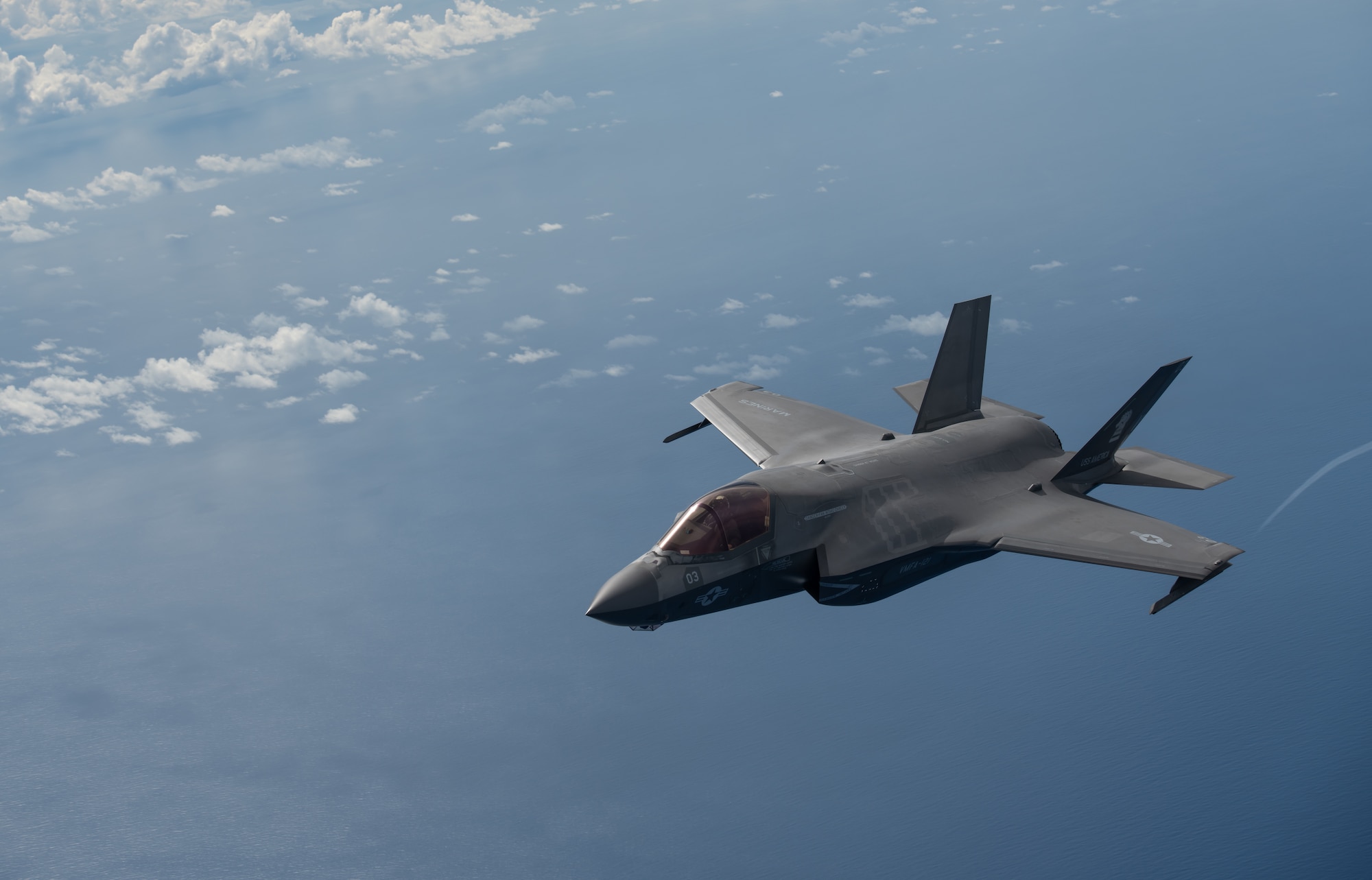 A U.S. Marine Corps F-35B Lightning II, Marine Fighter Attack Squadron based out of Marine Corps Air Station MCAS Iwakuni, Japan, breaks away after receiving fuel from a KC-135 Stratotanker assigned to the 909th Air Refueling Squadron, Kadena Air Base, Japan during a Large Scale Global Exercise 21 mission over the western Pacific Ocean, Aug. 18, 2021. World events underscore the urgency to develop the multi-domain operating capability; especially in the Indo-Pacific. (U.S. Air Force photo by Tech. Sgt. Micaiah Anthony)