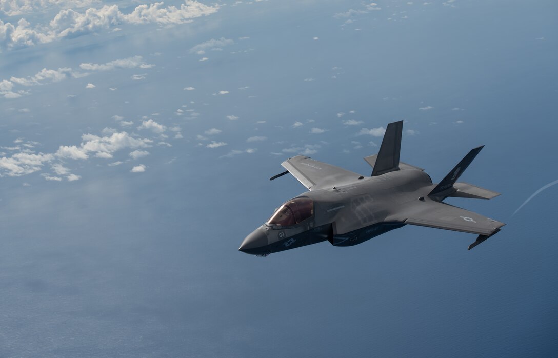 A U.S. Marine Corps F-35B Lightning II, Marine Fighter Attack Squadron based out of Marine Corps Air Station MCAS Iwakuni, Japan, breaks away after receiving fuel from a KC-135 Stratotanker assigned to the 909th Air Refueling Squadron, Kadena Air Base, Japan during a Large Scale Global Exercise 21 mission over the western Pacific Ocean, Aug. 18, 2021. World events underscore the urgency to develop the multi-domain operating capability; especially in the Indo-Pacific. (U.S. Air Force photo by Tech. Sgt. Micaiah Anthony)