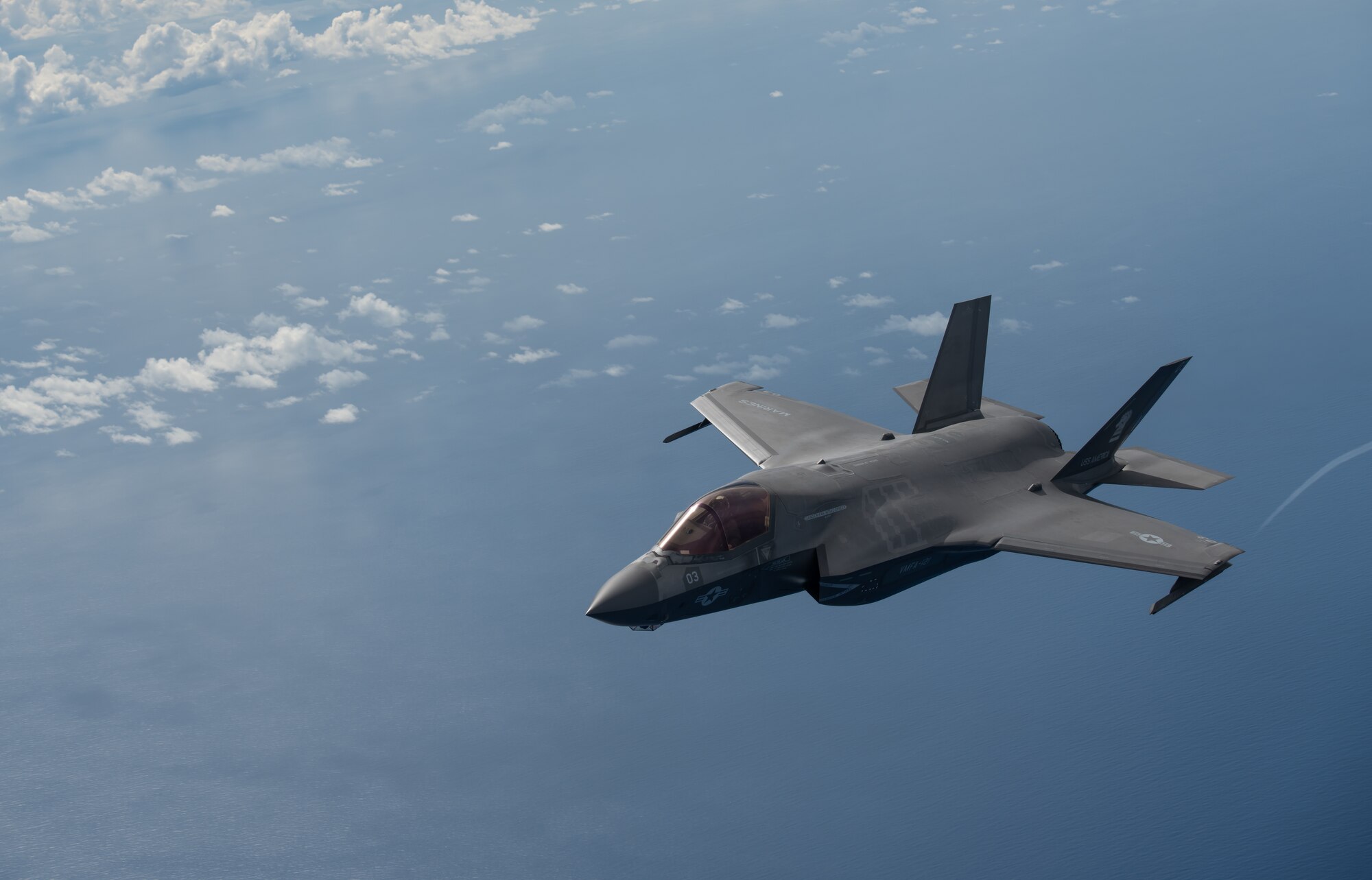 A U.S. Marine Corps F-35B Lightning II, Marine Fighter Attack Squadron based out of Marine Corps Air Station MCAS Iwakuni, Japan, breaks away after receiving fuel from a KC-135 Stratotanker assigned to the 909th Air Refueling Squadron, Kadena Air Base, Japan during a Large Scale Global Exercise 21 mission over the western Pacific Ocean, Aug. 18, 2021. World events underscore the urgency to develop the multi-domain operating capability; especially in the Indo-Pacific. (U.S. Air Force photo by Tech. Sgt. Micaiah Anthony)