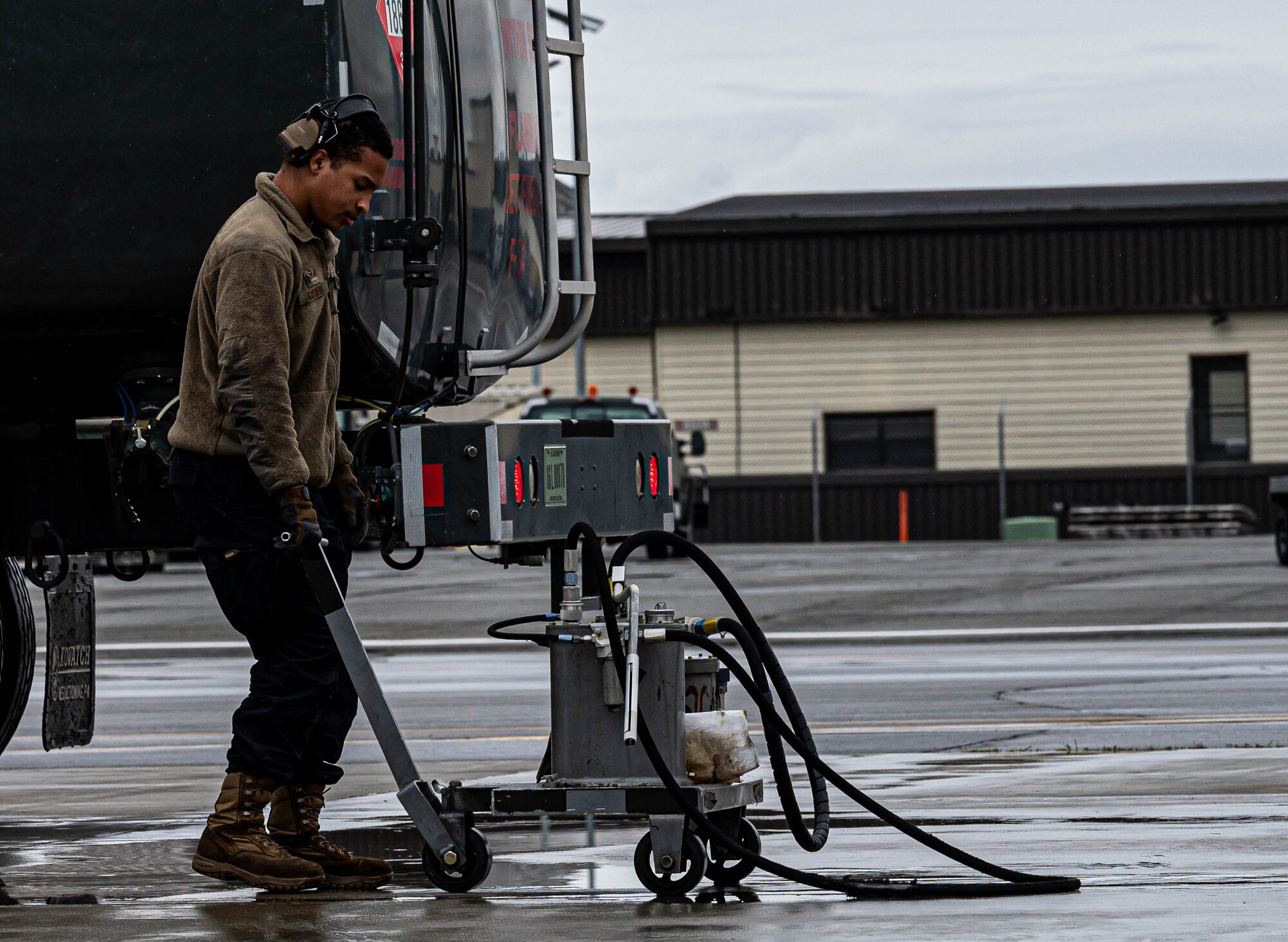 An Airman preps an F-22.