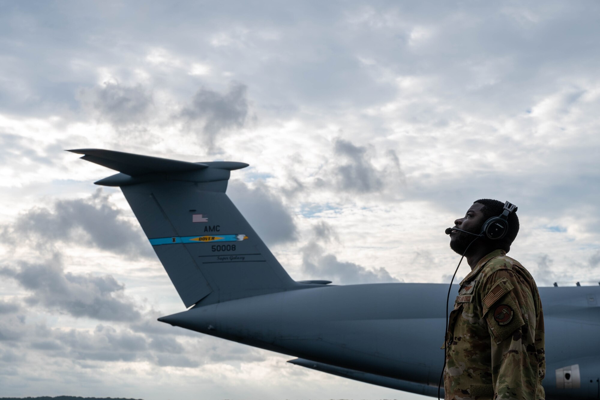 Staff Sgt. Sean Stegall, 9th Airlift Squadron flight engineer, performs a walk-around pre-flight check on a C-5M Super Galaxy before takeoff to Hamid Karzai International Airport, Afghanistan from Dover Air Force Base, Delaware, Aug. 16, 2021. Air Mobility Airmen play a key role in facilitating the safe departure and relocation of U.S. citizens, Special Immigration Visa recipients, and vulnerable Afghan populations from Afghanistan. (U.S. Air Force photo by Senior Airman Faith Schaefer)