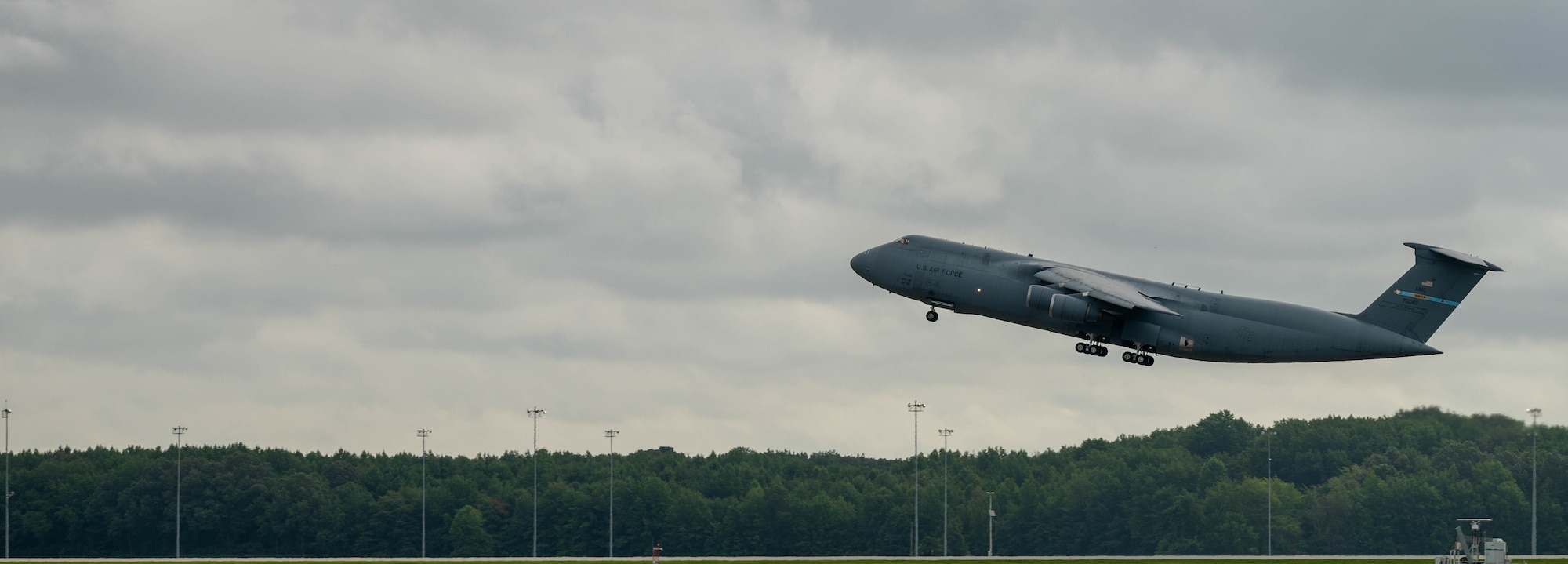 A C-5M Super Galaxy takes off to Hamid Karzai International Airport, Afghanistan from Dover Air Force Base, Delaware, Aug. 16, 2021. Air Mobility Airmen play a key role in facilitating the safe departure and relocation of U.S. citizens, Special Immigration Visa recipients, and vulnerable Afghan populations from Afghanistan. (U.S. Air Force photo by Senior Airman Faith Schaefer)