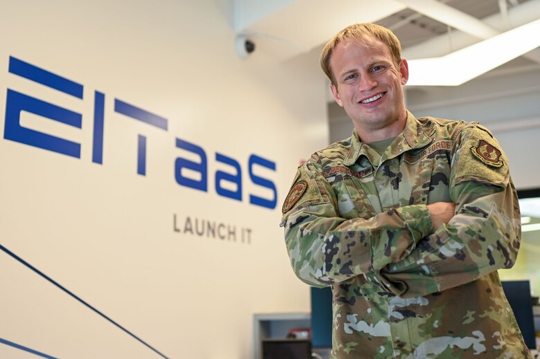 Capt. Andrew Beckman, an Enterprise Information Technology-as-a-Service program manager, poses for a photo at the Hanscom Air Force Base, Mass., Collaborative Nerve Center Aug. 23.