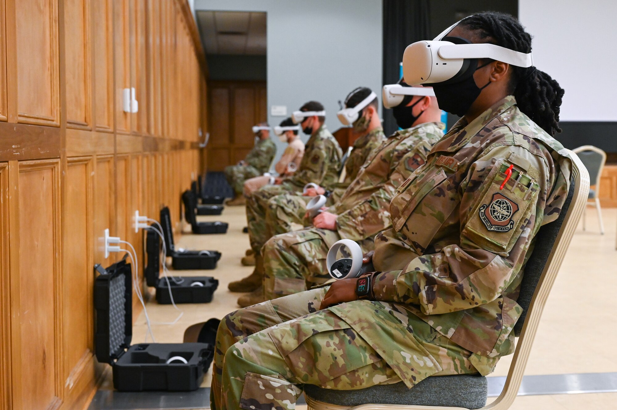 A group of Airmen use virtual reality headsets