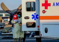 Airmen provides comfort to an evacuee child.