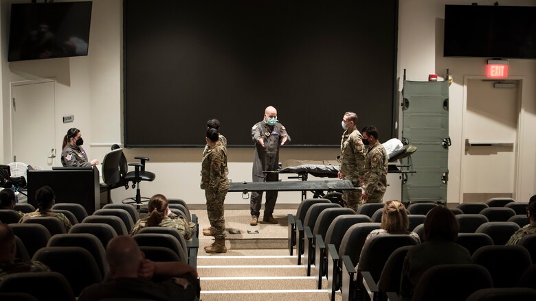 Tech. Sgt. Robert Van Aken, an instructor and medical technician with the U.S. Air Force School of Aerospace Medicine, delivers the lecture-portion of the all-day training Aug. 12 to medics with the 88th Medical Group at Wright-Patterson Medical Center. The training equipped the medics with proper skills to load and unload injured patients. (U.S. Air Force photo/Richard Eldridge)