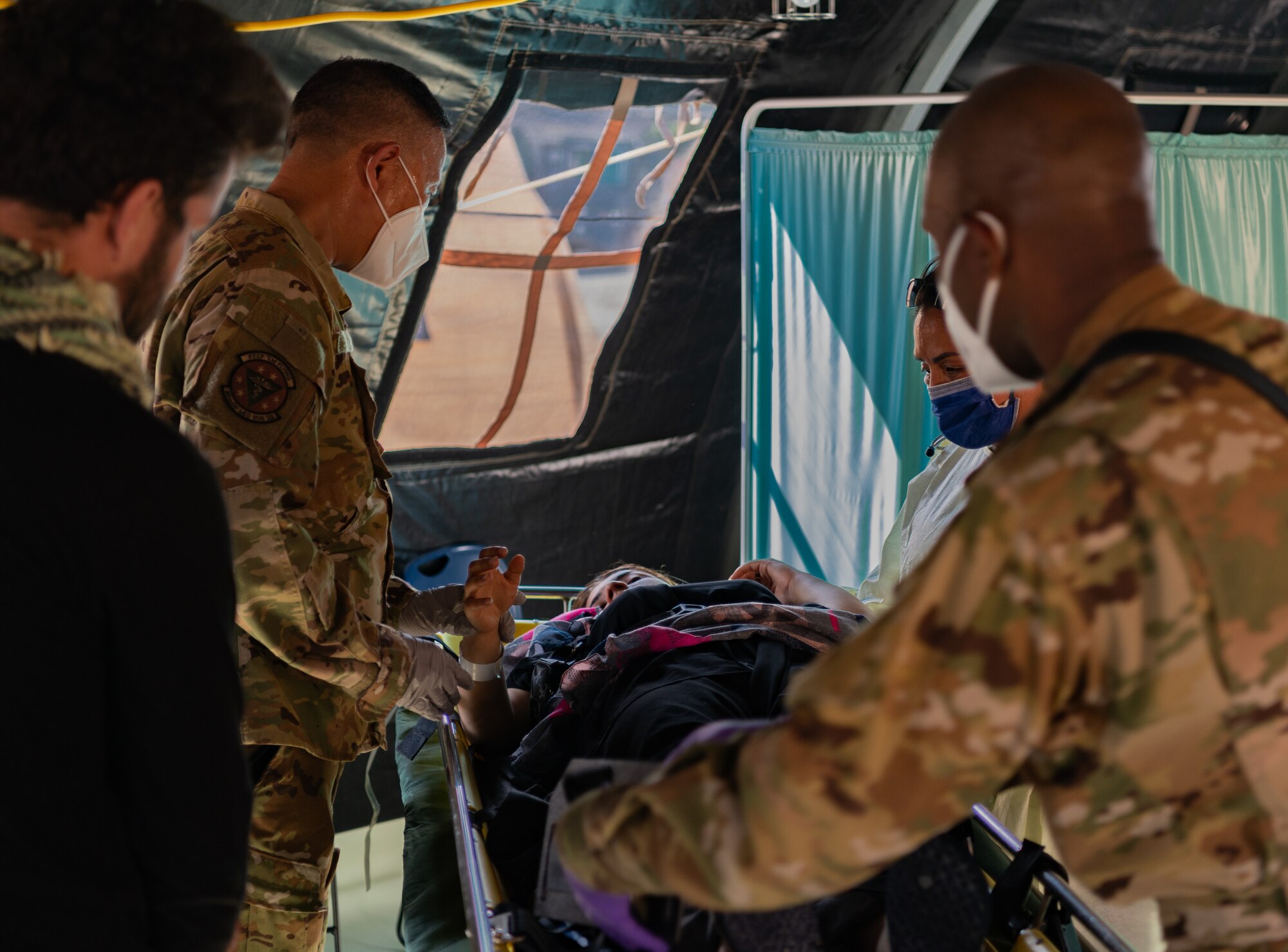 Airmen provide post labor care to mother.