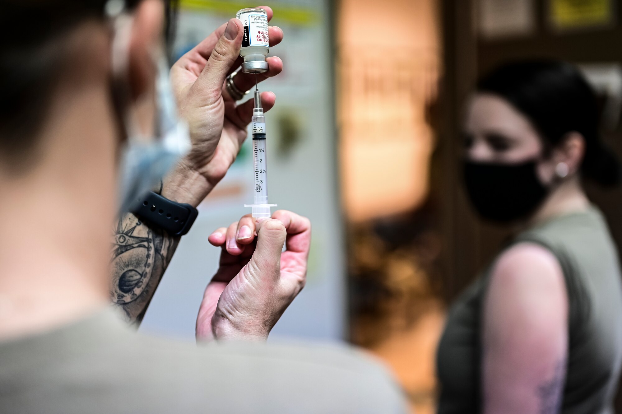 Master Sgt. Luca Farkas, 911th Aeromedical Staging Squadron aeromedical technician, fills a syringe with the COVID-19 vaccine at the Pittsburgh International Airport Air Reserve Station, Pennsylvania, Jan. 28, 2021. The 911th Airlift Wing is committed to taking every precaution to ensure the health and wellbeing of all personnel and their families as well as the community we share. (U.S. Air Force photo by Joshua J. Seybert)