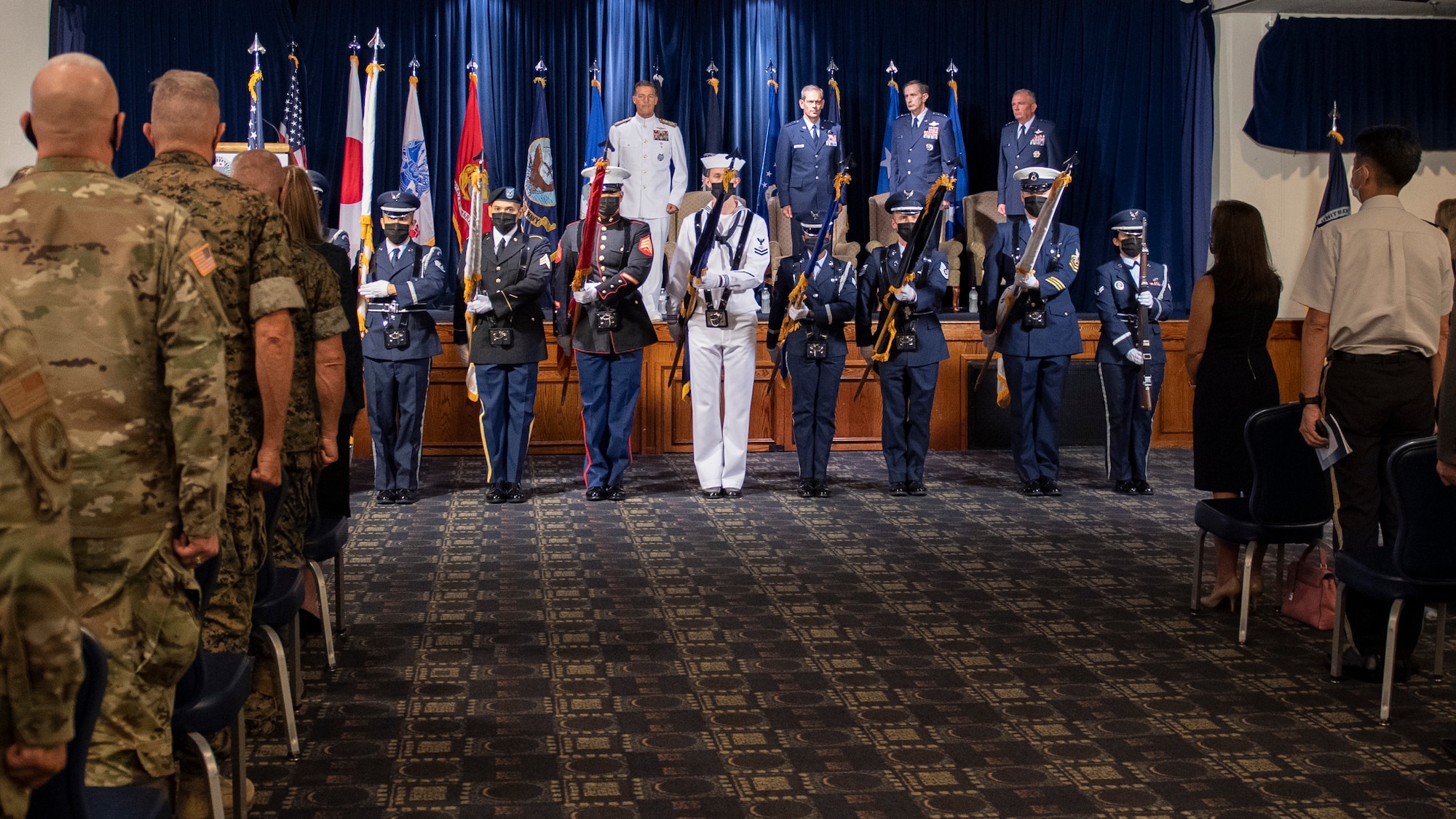 Joint U.S. Forces Japan color guard members present the colors during the USFJ and 5th Air Force change of command ceremony at Yokota Air Base, Japan, Aug. 27, 2021.