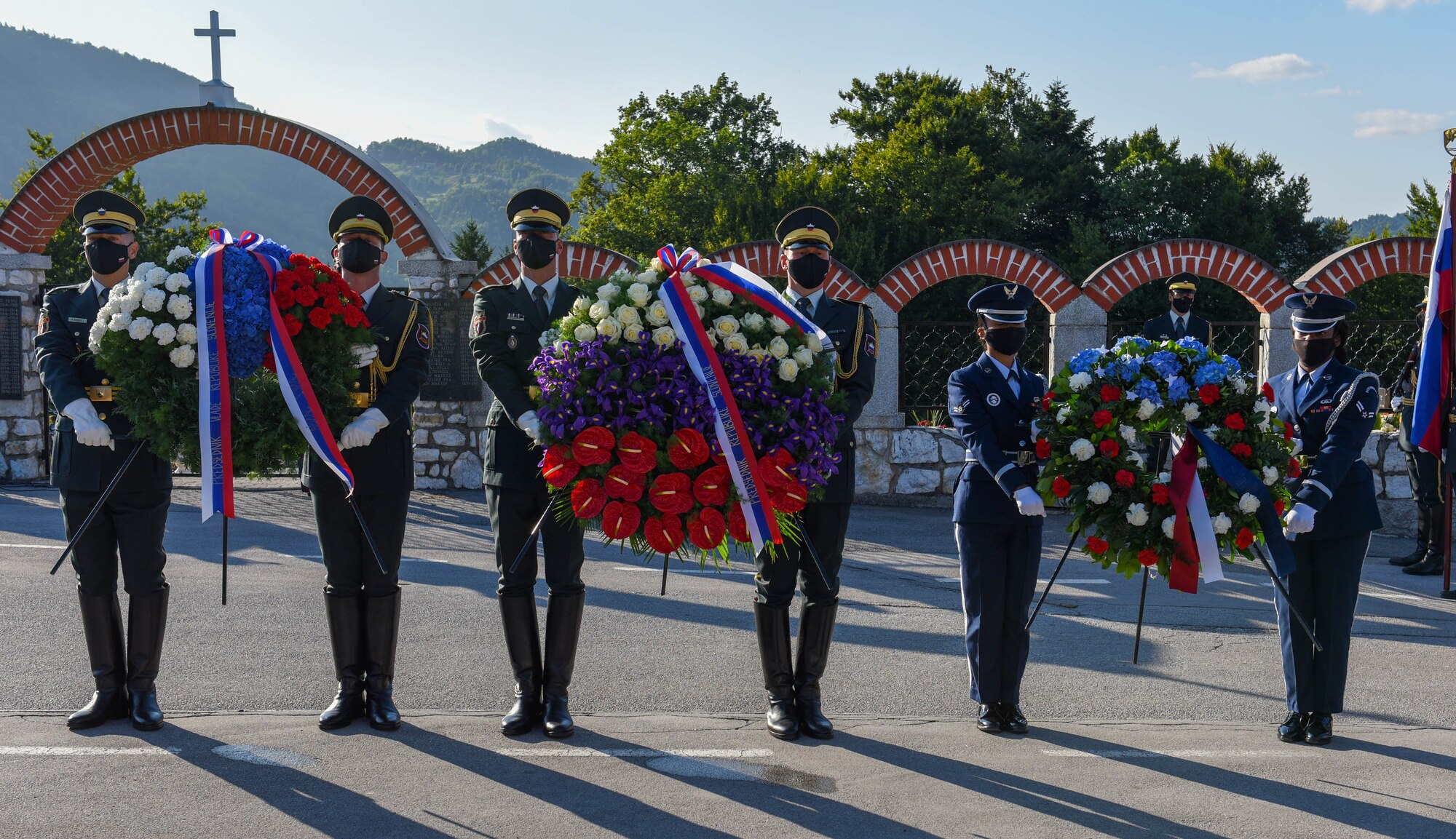 U.S. Air Force honor guard members assigned to the 31st Fighter Wing and Slovenian honor guard prepare to lay down a wreath in remembrance of the downed B-17 bomber ‘Dark Eyes’ which was shot down over Andraž on March 19, 1944, at the Andraž Memorial in Andraž nod Polzelo, Slovenia, Aug. 25, 2021. ‘Dark Eyes’ was shot down over Andraž nod Polzelo and the memorial to the B-17 Bomber was dedicated on March 22, 2014. (U.S. Air Force photo by Senior Airman Brooke Moeder)