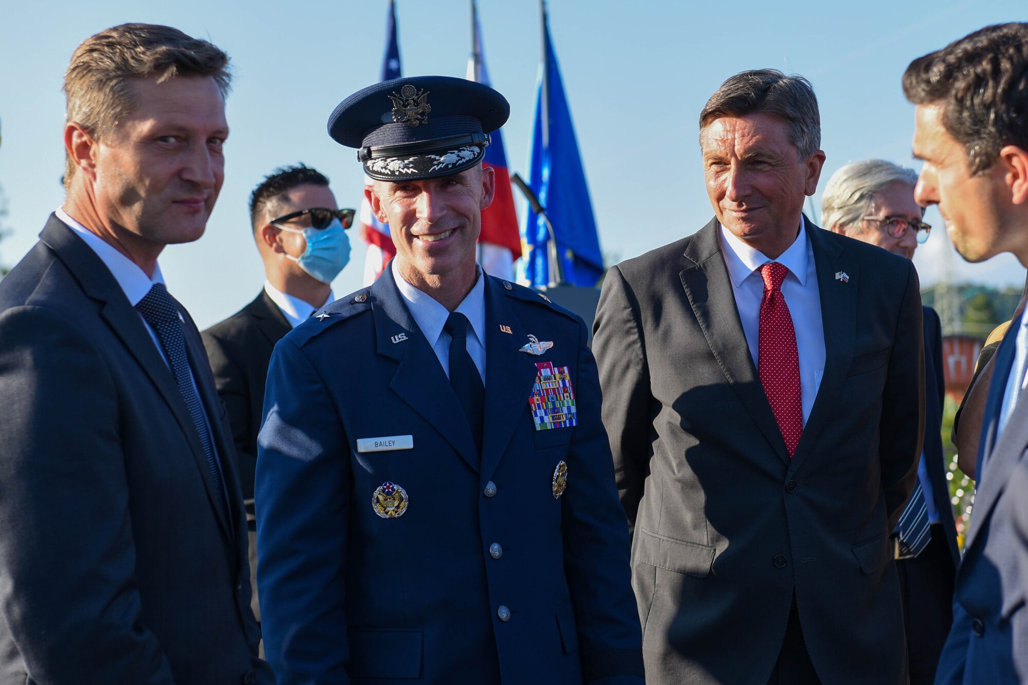 U.S. Air Force Brig. Gen. Jason E. Bailey, 31st Fighter Wing commander, middle, talks with Borut Pahor, Slovenian President of the Republic, right, and other leadership at the Andraž Memorial in Andraž nod Polzelo, Slovenia, Aug. 25, 2021. In 1944, the U.S. B-17 bomber ‘Dark Eyes’ was shot down over Andraž nod Polzelo and the memorial to ‘Dark Eyes’ was dedicated on March 22, 2014. Members of the crew killed in action are buried at the Florence American Cemetery, Florence, Italy. (U.S. Air Force photo by Senior Airman Brooke Moeder)