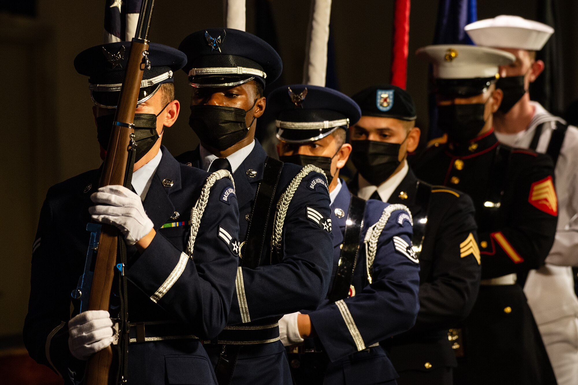 Joint U.S. Forces Japan color guard members present the colors during the USFJ and 5th Air Force change of command ceremony at Yokota Air Base, Japan, Aug. 27, 2021.