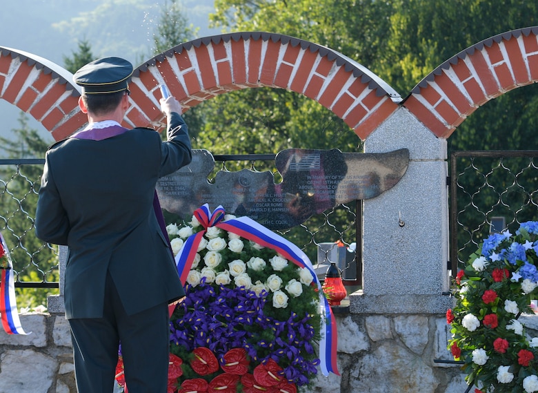 Military chaplain Matej Jakopic blesses a memorial plaque during the Andraž memorial in Andraž nod Polzelo, Slovenia, Aug. 25, 2021. In 1944, the U.S. B-17 bomber ‘Dark Eyes’ was shot down over Andraž nod Polzelo and the memorial to ‘Dark Eyes’ was dedicated on March 22, 2014. Members of the crew killed in action are buried at the Florence American Cemetery, Florence, Italy. (U.S. Air Force photo by Senior Airman Brooke Moeder)