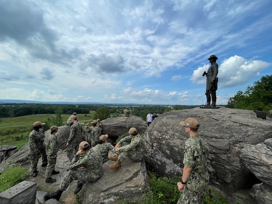 Sailors assigned to the guided-missile cruiser USS Gettysburg (CG 64) gather at Little Round Top, a historic landmark from the Battle of Gettysburg, prior to a day of preservation projects in Gettysburg National Park. Gettysburg Sailors traveled to Gettysburg, Pa. for a three-day namesake visit, where they performed several community relations projects and connected with the Gettysburg community. (U.S. Navy courtesy photo)