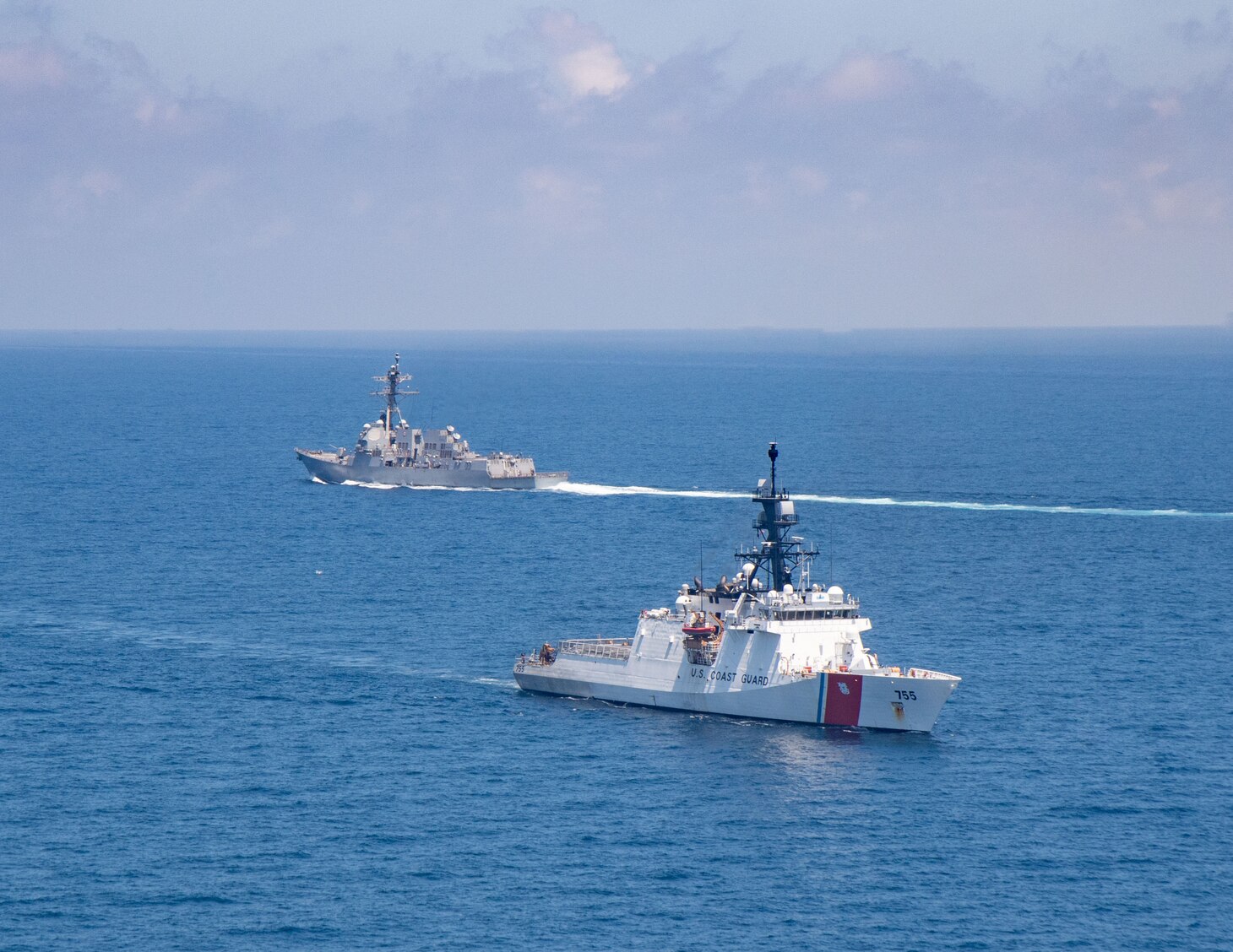 TAIWAN STRAIT (Aug. 27, 2021) Legend-class U.S. Coast Guard National Security Cutter Munro (WMSL 755) transits the Taiwan Strait during a routine transit with Arleigh-burke class guided-missile destroyer USS Kidd (DDG 100), Aug. 27. Kidd is deployed supporting Commander, Task Force (CTF) 71/Destroyer Squadron (DESRON) 15, the Navy’s largest forward-deployed DESRON and U.S. 7th Fleet’s principal surface force.
