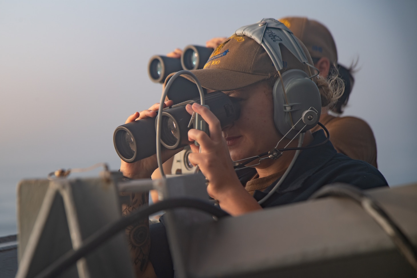 TAIWAN STRAIT (Aug. 27, 2021) Operations Specialist Seaman Apprentice Camryn Campbell, from Pembroke, N.C., stands starboard lookout aboard Arleigh-burke class guided-missile destroyer USS Kidd (DDG 100) while conducting routine operations, Aug. 27. Kidd is deployed supporting Commander, Task Force (CTF) 71/Destroyer Squadron (DESRON) 15, the Navy’s largest forward-deployed DESRON and U.S. 7th Fleet’s principal surface force.