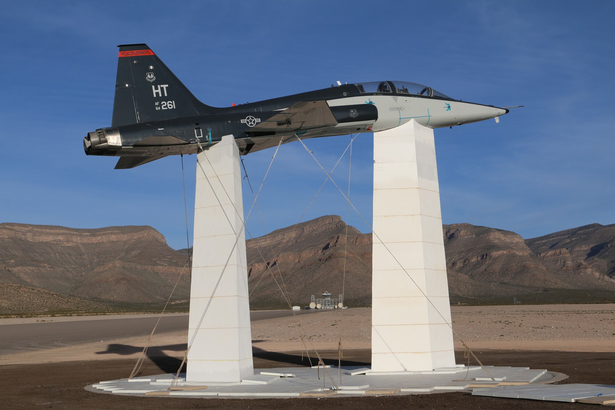 A T-38C is mounted to the large turntable for radar cross section testing using supports made from the previous type of foam used by the 704th Test Group, Detachment 1 at the National Radar Cross Section Test Facility at White Sands Missile Range in New Mexico in 2017. A new, sturdier type of foam now being used by the Detachment will allow the supports to be much smaller and cause less contamination in the data. (U.S. Air Force photo)