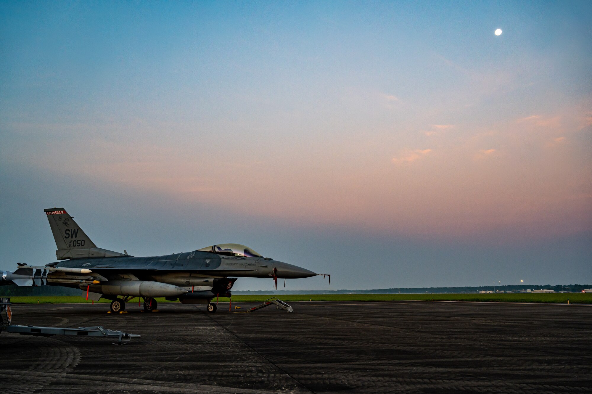 A picture of a jet on the flightline.