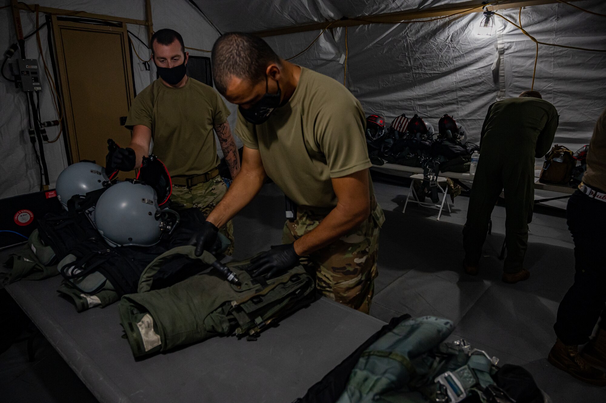 A picture of Airmen working in a tent.