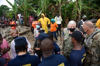 U.S. Navy Adm. Craig Faller, Commander of U.S. Southern Command, Administrator Samantha Power with United States Agency for International Development and U.S. Army Col. Steven Gventer, commander of Joint Task Force-Bravo, meet with relief workers in  Maniche, Haiti, Aug. 26, 2021.